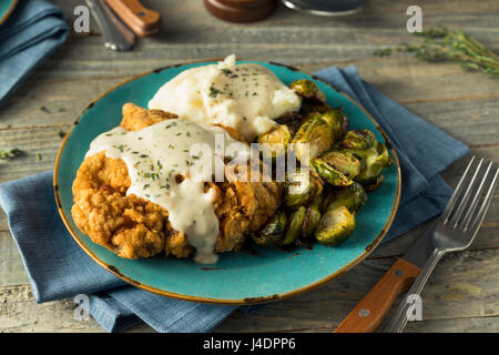 Homemade Country Fried Steak with Gravy and Potatoes Stock Photo