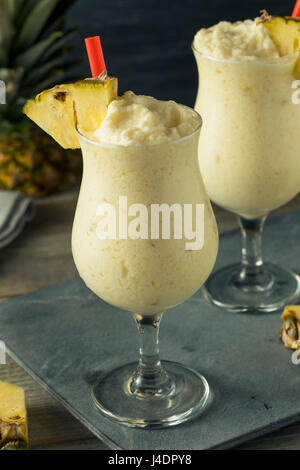 Homemade Frozen Pina Colada Cocktail with a Pineapple Garnish Stock Photo