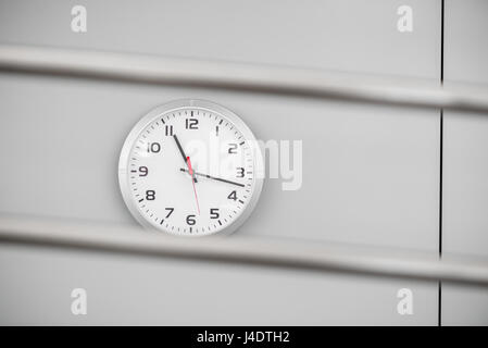 Stylish quartz watch on the wall in the room Stock Photo