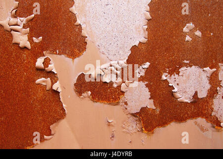 Flaking and cracked paint on rusty iron - grunge texture Stock Photo