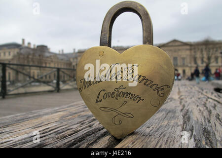 Paris, France. 22nd Feb, 2017. A love lock with the inscription 'Michelle & Barack Love Forever' stands on a wooden bench at Pont des Arts' pedestrian bridge at the Seine in Paris, France, 22.02.2017. When the city of Paris removed the attached locks due to safety reasons in 2015, a couple saved several hundred. Now these locks are looking for their owners. Photo: Nadine Benedix/dpa/Alamy Live News Stock Photo