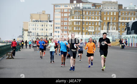 Brighton, UK. 13th May, 2017. Hundreds of people take part in the weekly Park Run fitness event along Brighton and Hove seafront on a dull overcast morning . The forecast is for a mixture of sunshine and showers this weekend in the south with warnings of a water shortage due to a lack of rain this Spring Credit: Simon Dack/Alamy Live News
