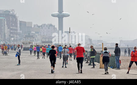 Brighton, UK. 13th May, 2017. Hundreds of people take part in the weekly Park Run fitness event along Brighton and Hove seafront on a dull overcast morning . The forecast is for a mixture of sunshine and showers this weekend in the south with warnings of a water shortage due to a lack of rain this Spring Credit: Simon Dack/Alamy Live News