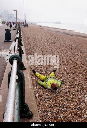 Brighton, UK. 13th May, 2017. This chap takes an early morning rest on Hove beach on a dull overcast morning . The forecast is for a mixture of sunshine and showers this weekend in the south with warnings of a water shortage due to a lack of rain this Spring Credit: Simon Dack/17�Թ����� Live News Stock Photo