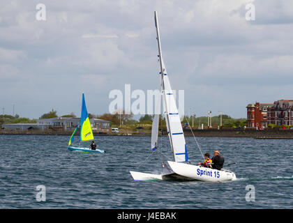 Catamaran Yachting on a windy Southport, Merseyside.  UK Weather.  Clearing Skies and a Fresh breeze over Marine Lake as Southport Sailing Club stages it 2017 Open Day. The club is fully booked for trial and novice sailors to enjoy one half hour on the resorts Marine Lake, in testing conditions, on a variety of craft. As has been the case for the last few years this coincides with the RYA push the boat out initiative – to nationally get people on the water and interested in sailing! Credit; MediaWorldImage/AlamyLiveNews Stock Photo