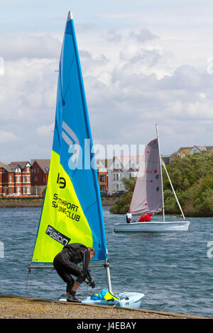 Yachting on a windy Southport, Merseyside.  UK Weather.  Clearing Skies and a Fresh breeze over Marine Lake as Southport Sailing Club stages it 2017 Open Day. The club is fully booked for trial and novice sailors to enjoy one half hour on the resorts Marine Lake, in testing conditions, on a variety of craft. As has been the case for the last few years this coincides with the RYA push the boat out initiative – to nationally get people on the water and interested in sailing! Credit; MediaWorldImage/AlamyLiveNews Stock Photo