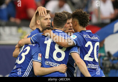 Gelsenkirchen, Germany. 13th May, 2017. Guido Burgstaller (L) of Schalke, who scored, and his teammates Daniel Caligiuri, Klaas-Jan Huntelaar and Thilo Kehrer (L-r) cheer during the German Bundesliga soccer match between FC Schalke 04 and Hamburger SV at the Veltins Arena in Gelsenkirchen, Germany, 13 May 2017. (EMBARGO CONDITIONS - ATTENTION: Due to the accreditation guidelines, the DFL only permits the publication and utilisation of up to 15 pictures per match on the internet and in online media during the match.) Photo: Ina Fassbender/dpa/Alamy Live News Stock Photo