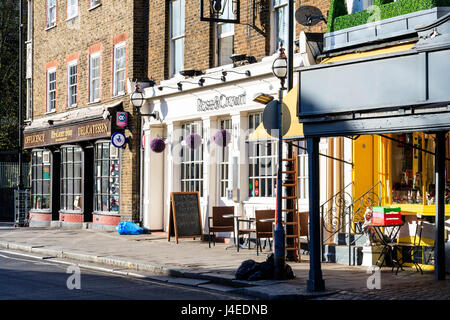 'The Corner Shop' delicatessen (now a branch of Gail's bakery) and the Rose & Crown (now Le Pain Quotidien) in Highgate Village, London, UK, 2011 Stock Photo