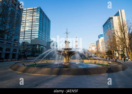 Fountain in the Odori Park, downtown Sapporo at sunset, Hokkaido, Japan, Asia Stock Photo