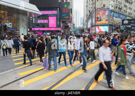 Pedestrians crossing street, Causeway Bay, Hong Kong Island, Hong Kong, China, Asia Stock Photo