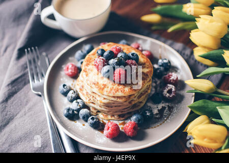 Breakfast variations. Pancakes with berries and stroop syrup. Stock Photo