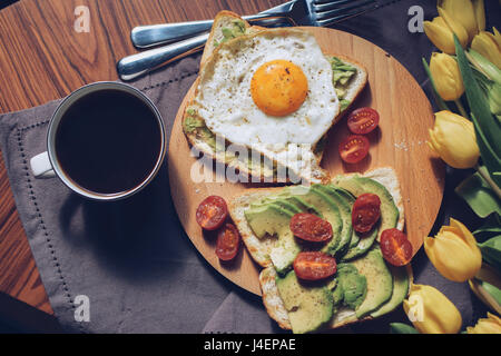 Breakfast variations. Avocado on a toasted bread. Stock Photo