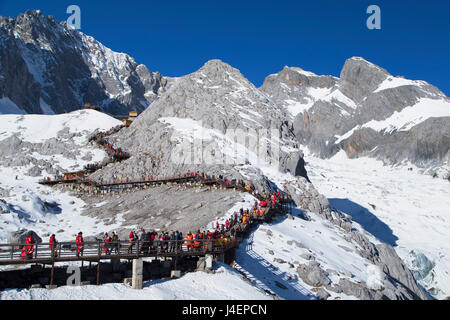 Tourists on Jade Dragon Snow Mountain (Yulong Xueshan), Lijiang, Yunnan, China, Asia Stock Photo