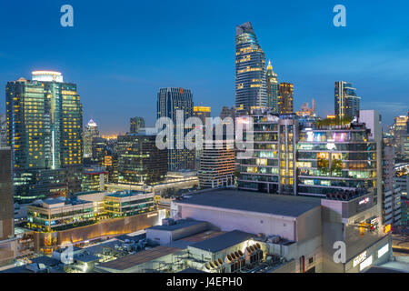 City skyline at dusk from hotel rooftop bar, Bangkok, Thailand, Southeast Asia, Asia Stock Photo