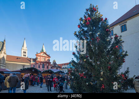 A decorated Christmas tree frames the St. George Church, Prague, Czech Republic, Europe Stock Photo