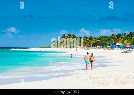 Couple walking on world class Shoal Bay East beach, Anguilla, British Oversea territory, West Indies, Caribbean, Central America Stock Photo