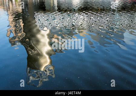 Abstract patterns in water, formed by the reflection of the Lowry Arts Centre building, Salford Quays, Manchester, England, UK Stock Photo