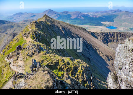 On the Rhyd Ddu path approaching the summit of Snowdon showing Bwlch Main and Llechog with the Nantle hills in the distance. Snowdonia, North Wales Stock Photo