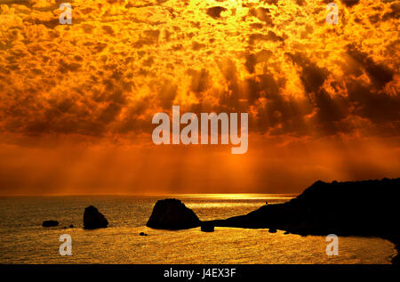 Sunset at 'Petra tou Romiou' ('Greek's Rock', also known as 'Aphrodite's Rock' or 'Aphrodite's beach'), the 'birthplace' of Aphrodite (Venus), Cyprus. Stock Photo