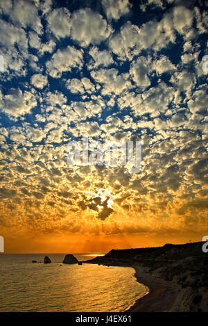 Sunset at 'Petra tou Romiou' ('Greek's Rock', also known as 'Aphrodite's Rock' or 'Aphrodite's beach'), the 'birthplace' of Aphrodite (Venus), Cyprus. Stock Photo