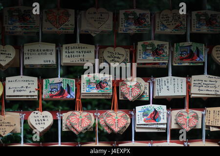 Kyoto,Japan,25 June 2016,Heart and rectangular shape of wood badge for a blessing in Japanese-style call EMA within shrine at Arashiyama . Stock Photo