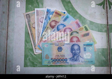 Vietnamese bank notes: 1000, 2000, 5000, 10000, 20000, 50000, 100000, 200000 and 500000 vietnam dongs (VND) on the table. Amount of 500000 VND is equa Stock Photo