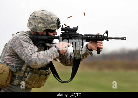 U.S. Air Force Senior Airman, a security forces specialist fires an M4 carbine rifle during target practice