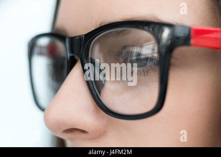 Business woman in glasses standing in office. Close-up photo Stock Photo