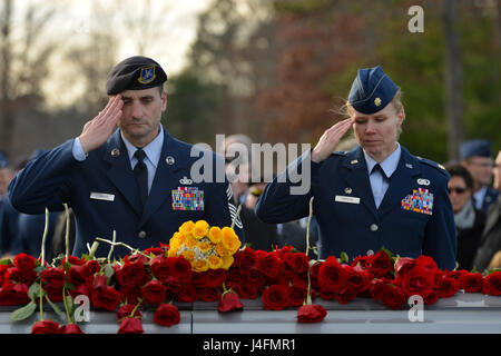 Chief Master Sgt. Marc Sommers, assigned to the 105th Base Defense Squadron, and Maj. Alta Caputo, commander of the 105th BDS, pay their respects at the funeral of Staff Sgt. Louis M. Bonacasa, also of the 105th BDS, Jan. 2, 2016. Bonacasa was killed in action outside of Bagram Airfield, Afghanistan Dec. 21, 2015. (U.S. Air Force photo by Staff Sgt. Julio. A. Olivencia jr.) Stock Photo
