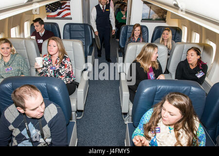 Spouses of 1st Airlift Squadron and 99th Airlift Squadron pilots, communications systems operators, flight attendants, flight engineers and flying crew chiefs fly on board Boeing C-32A and C-40B, and Gulfstream C-37B and C-37A aircraft during the 89th Airlift Wing spouse appreciation day at Joint Base Andrews, Md., Jan. 11, 2016. The 89th AW maintains and operates 'Air Force One' and 14 other special air mission platforms. (U.S. Air Force photo by Senior Master Sgt. Kevin Wallace/RELEASED) Stock Photo