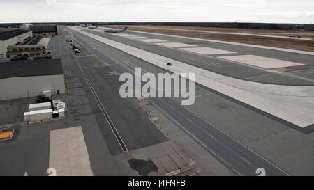 Two C-17A Globemaster IIIs and a C-5M Super Galaxy sit on the flight line Feb. 25, 2016, at Dover Air Force Base, Del. Dover AFB’s other 11 C-17s and 17 C-5s are either in heavy maintenance or off station due to Dover’s ongoing runway construction project. (U.S. Air Force photo/Senior Airman Zachary Cacicia) Stock Photo