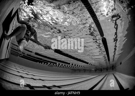 Lee Kuxhous, Air Force Trials swimming competitor, races fellow swimmers during the 2016 Air Force Trials Feb. 28, 2016 at University of Nevada Las Vegas Buchanan Natatorium, Las Vegas, NV. The Air Force Trials are an adaptive sports event designed to promote the mental and physical well-being of seriously wounded, ill and injured military members and veterans. More than 100 wounded, ill or injured service men and women from around the country will compete for a spot on the 2016 Warrior Games Team which will represent the Air Force at the US Military Academy at West Point in June. (U.S. Air Fo Stock Photo