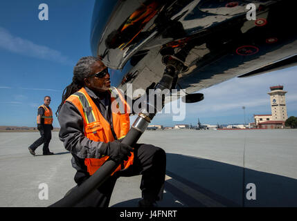 Jonathan Thorpe, assistant project manager, transient alert, 60th Maintenance Squadron, prepares to disconnect the hose from a T-38 Talon from Beale AFB for fueling, June 10, 2016, Travis AFB. Unlike self-service gas station, where cars and trucks must pull up to the pump, the responsibility of refueling airplanes falls on the shoulders of the fuels management flight personnel who must pull up to the parked aircraft in vehicles carrying the fuel.(U.S. Air Force Photo by Heide Couch) Stock Photo