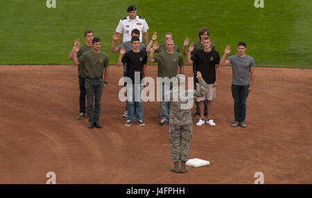 Col. Ryan Samuelson, 92nd Air Refueling Wing commander, preforms a joint service swear in of new military trainees during a military appreciation event at the Avista Baseball Stadium Sept. 27, 2016, in Spokane, Wash. The city of Spokane is well known for its support of the military and has annual military appreciation celebrations. Stock Photo