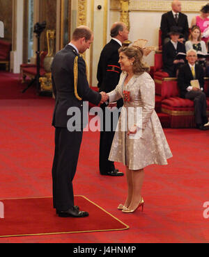 Alison Baum from London is made an OBE (Officer of the Order of the British Empire) by the Duke of Cambridge, during an Investiture ceremony at Buckingham Palace, London. Stock Photo