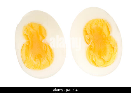 Double yolk hard boiled egg, cut out or isolated against a white background. Stock Photo