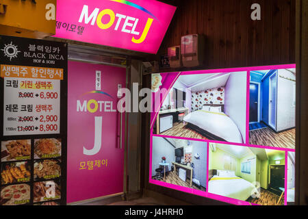 Busan, South Korea - March 27th, 2017: The Motel J entrance with photos of the rooms at a very narrow street in Busan. Stock Photo