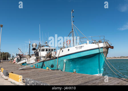 LAAIPLEK, SOUTH AFRICA - APRIL 1, 2017: A fishing boat at the harbor in the mouth of the Berg River at Laaiplek on the Atlantic coast of South Africa Stock Photo