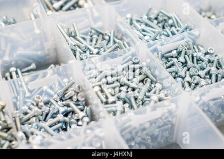 Stock of different sizes of bolts with Allen key fittings Stock Photo