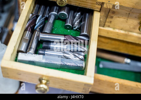 Dril bits in a wooden toolbox or tool Chest Stock Photo