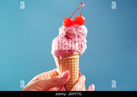 Melted amarena ice cream cone Stock Photo