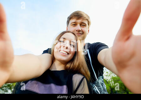 Couple makes selfie on the phone outdoors Stock Photo
