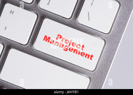 "Project Management" red words on white keyboard - online, education and business concept Stock Photo