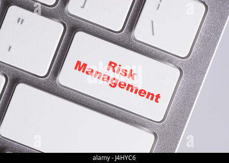 "Risk Management" red words on white keyboard - online, education and business concept Stock Photo
