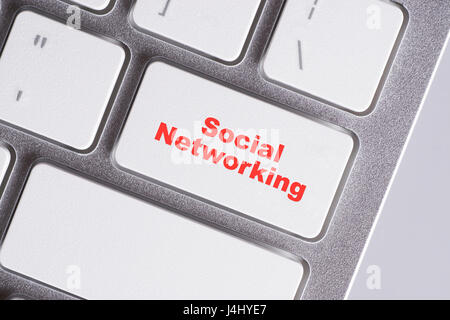 "Social networing" red words on white keyboard - online, education and business concept Stock Photo