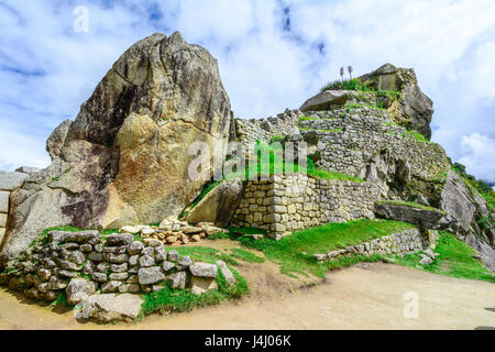 Sacred plaza and the hill with intiwatana observatory rock Stock Photo