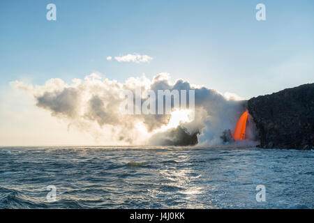 hot lava from the 61G flow from Kilauea Volcano enters the ocean at the Kamokuna entry in Hawaii Volcanoes National Park, Hawaii Island, USA Stock Photo