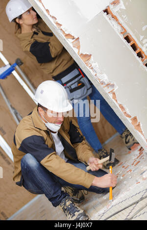 Renovation team working on property Stock Photo