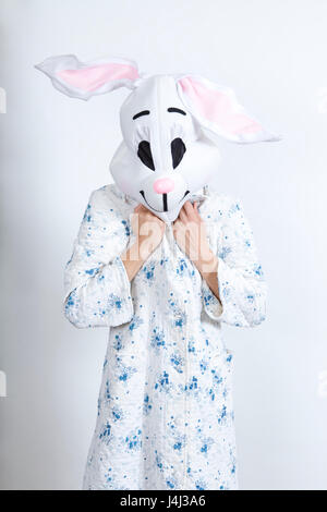 Rabbit difficult to wake in the morning He's cold dressing-up clothes and conceptual parody Stock Photo