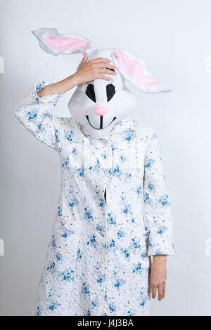 Rabbit difficult to wake in the morning he seems to have forgotten something dressing-up clothes and conceptual parody Stock Photo